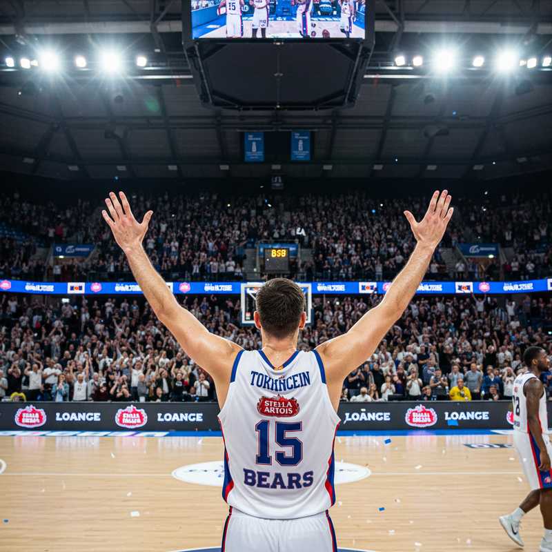 Basketball speler van Leuven Bears juicht na score in thuiswedstrijd BNXT League met publiek op achtergrond